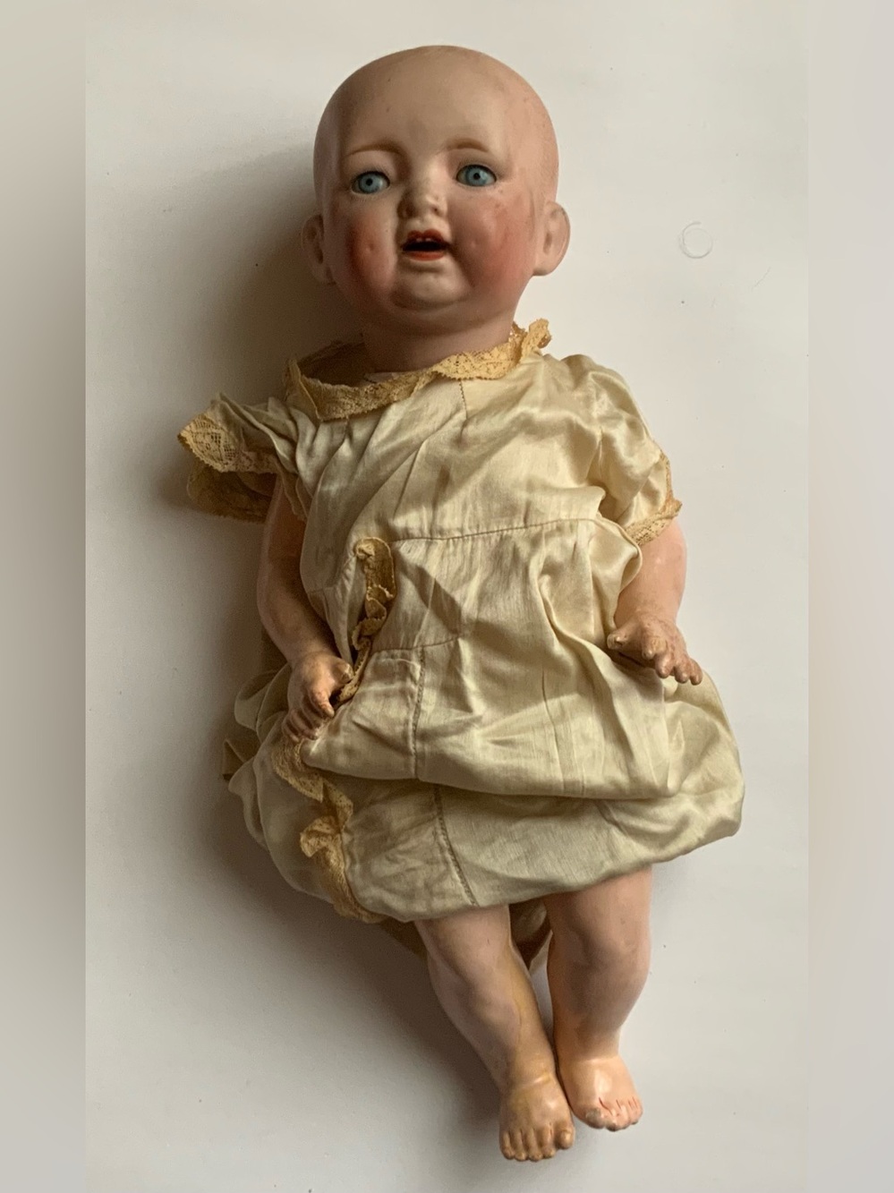 Antique Bisque Baby Doll in Cream Dress